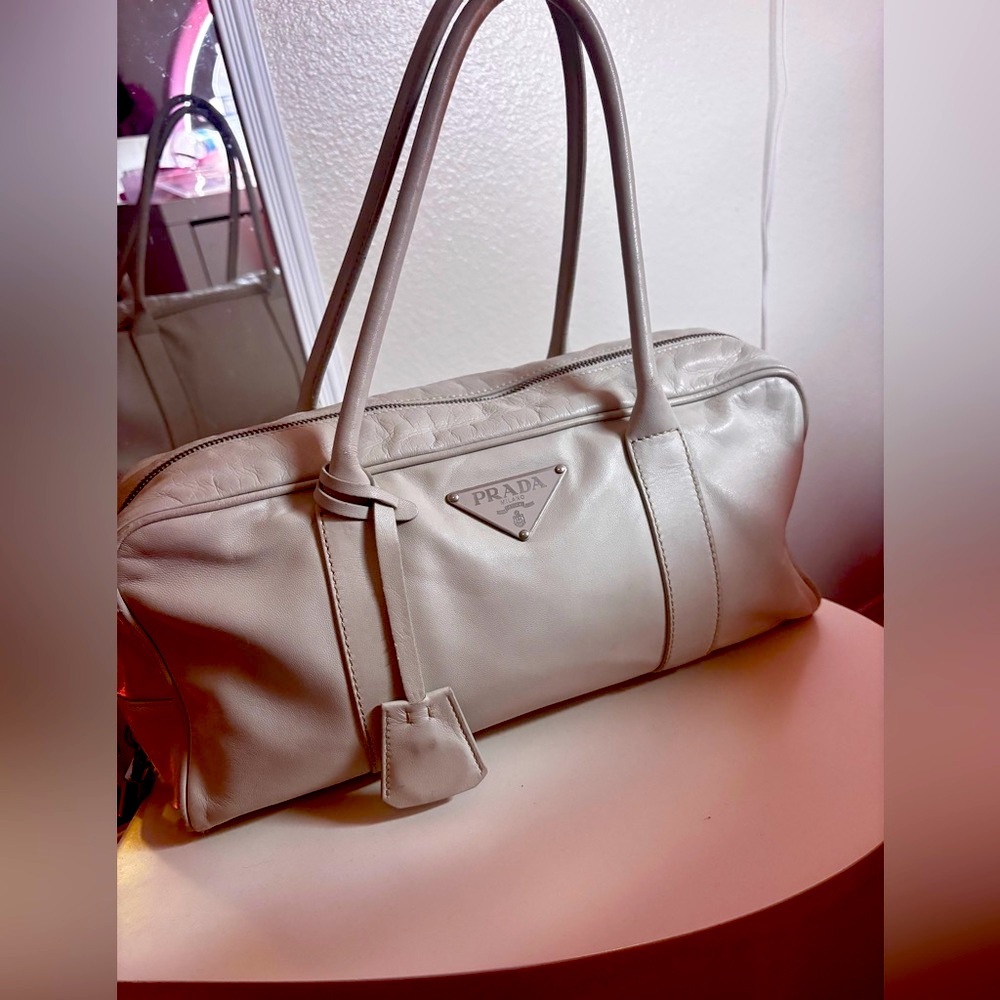 White vintage Prada bag.
